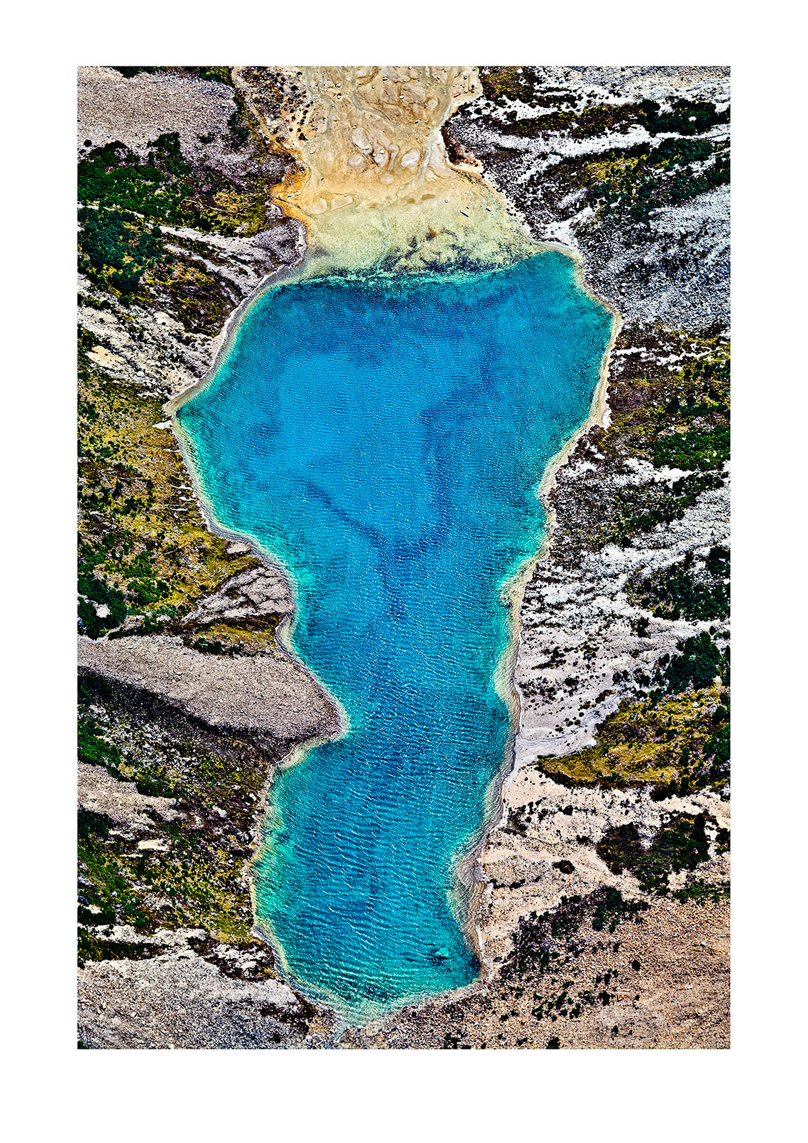 A lake fills with mineral-rich turquoise water from a glacier run-off. Ushuaia, Martial Mountains, Fuegian Andes, Ushuaia Bay, Tierra del Fuego Archipelago, Straits of Magellan, Tierra del Fuego Province, Patagonia, Argentina.