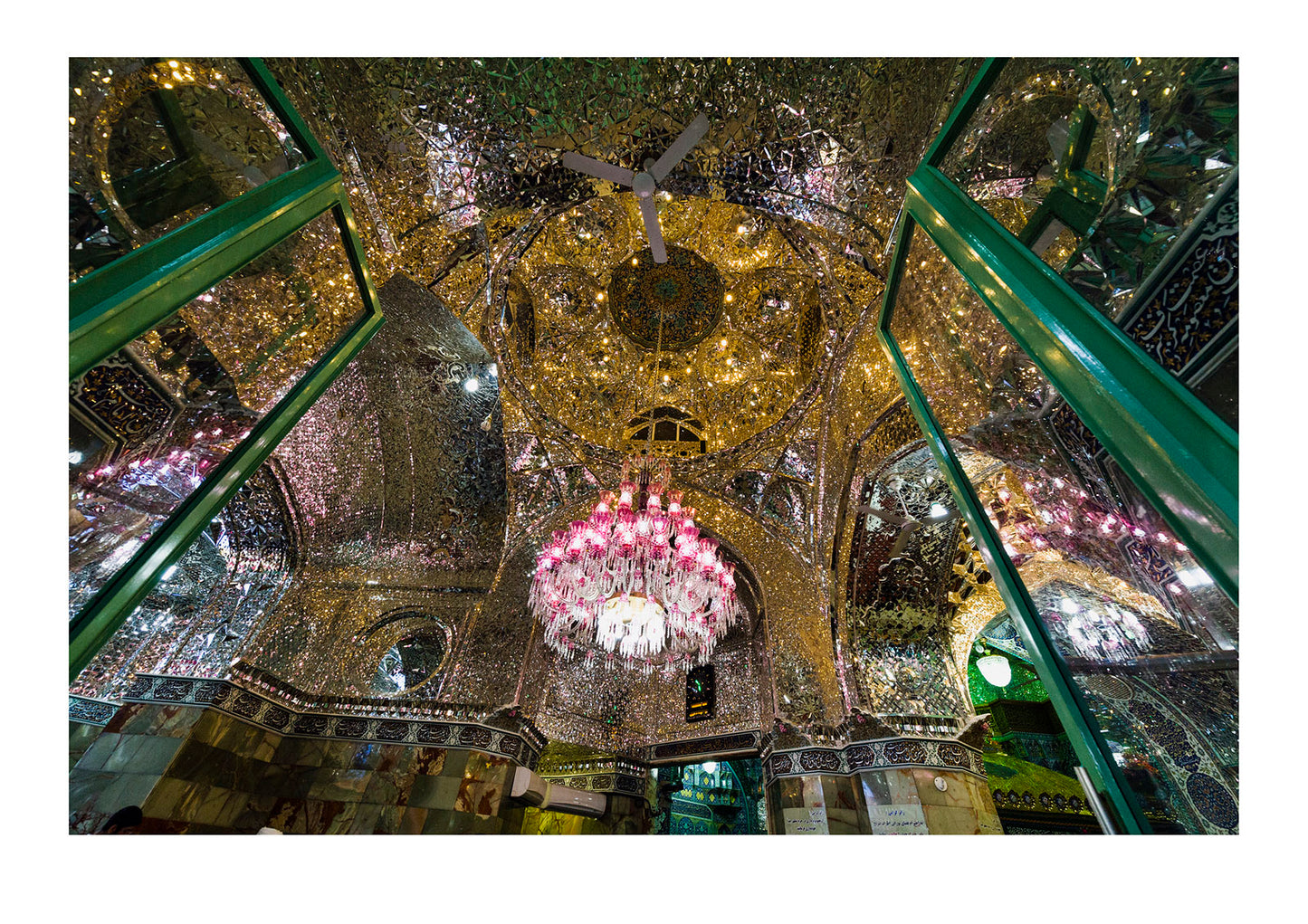 Light from the chandelier reflecting in all directions from the magnificent mirrored ceiling of the Holy shrine of Hazrat Masuma.
 Fatima Masumeh Shrine, Qom, Qom Province, Islamic Republic of Iran.

