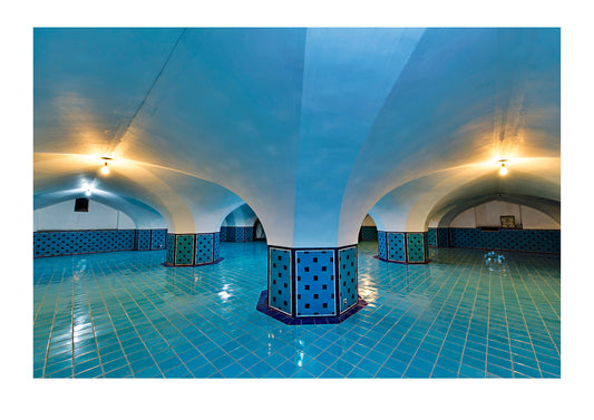 The blue tiled interior ceiling dome of an antique public bathhouse. Hammam-e khan, Yazd, Yazd Province, Islamic Republic of Iran.