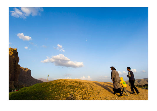 Iranian tourists visit the four tombs belonging to Achaemenid kings carved from the rock face at the archeological site of Naqsh-e Rustam also known as the Necropolis.. Tombs of the Kings, Naqsh-e Rustam, Fars Province, Islamic Republic of Iran.